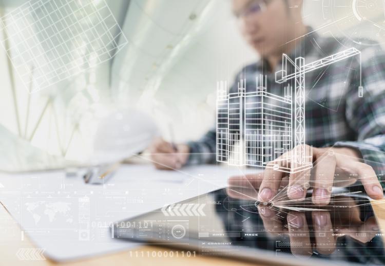 Engineering/detailer drawings overlaid on man using tablet